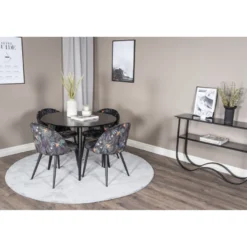 Ruokailuryhmä Venture Home, ⌀100cm musta Plaza-pöytä + 4 mustaa Velvet-tuolia kukkakuosilla