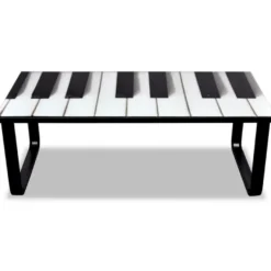 Sohvapöytä lasisella pöytälevyllä ja pianokuviolla