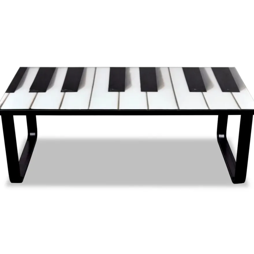 Sohvapöytä lasisella pöytälevyllä ja pianokuviolla