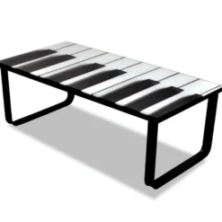 Sohvapöytä lasisella pöytälevyllä ja pianokuviolla